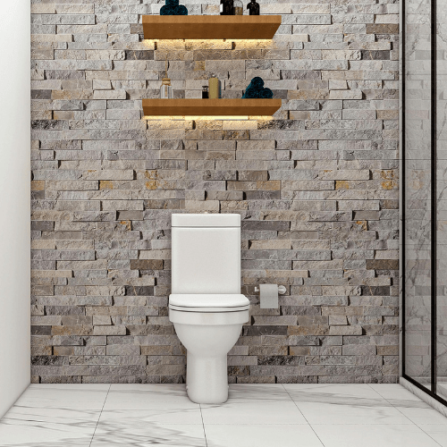 Barrierefreies WC und moderne Natursteinwand im Bad von Ademi Sanitär Delmenhorst